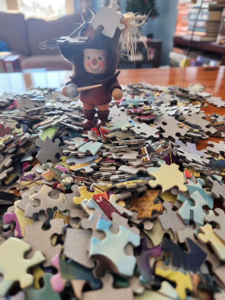 Musketeer figure in a pile of puzzle pieces