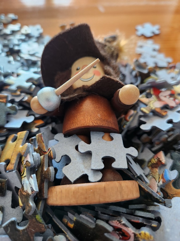 Musketeer figure in puzzle pieces