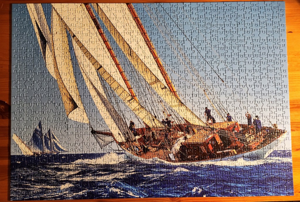 Completed puzzle of a sailboat at sea